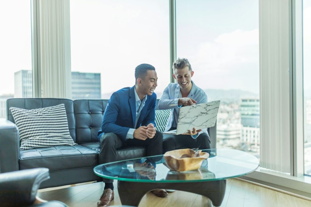 Tenant reviewing a commercial lease beside floor plans, keys, and a calculator on a desk